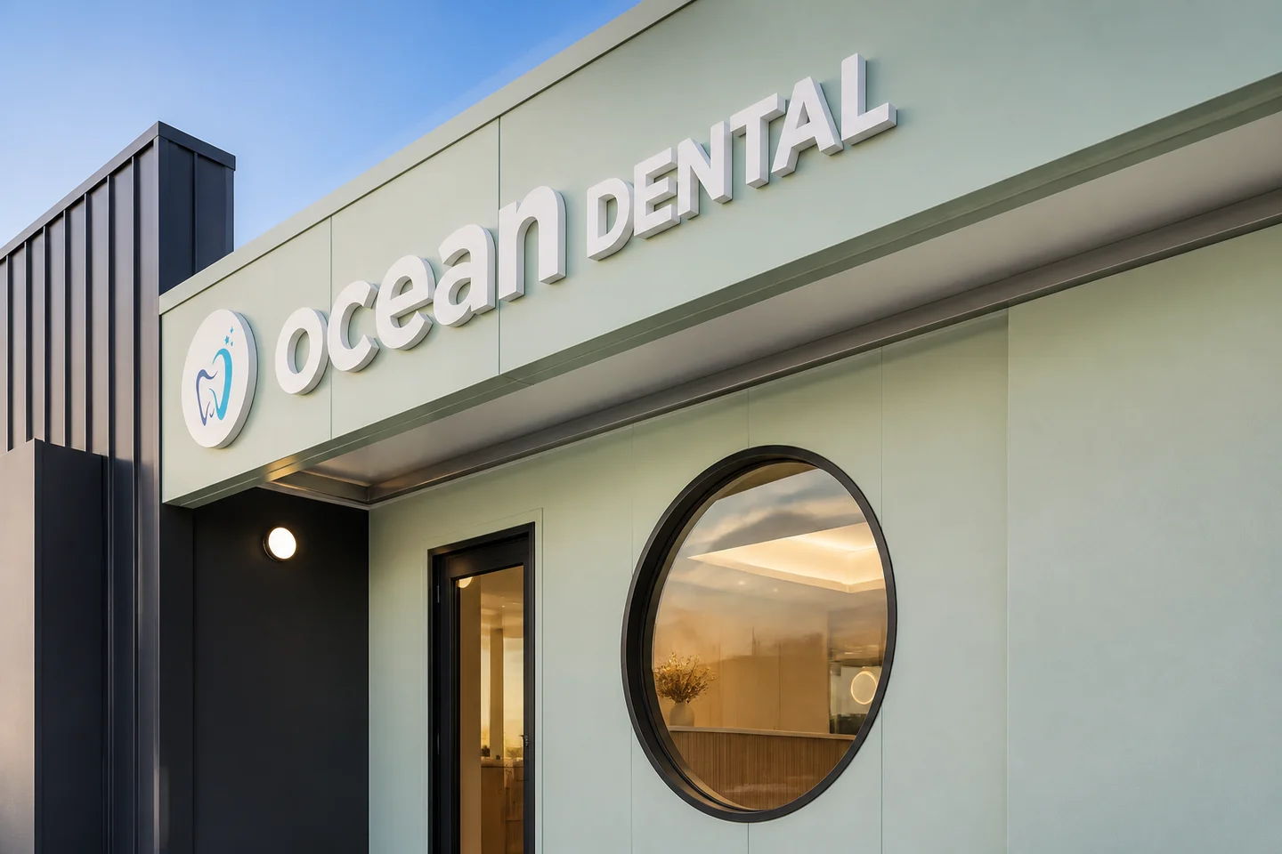 Ocean Dental sign, seafoam facade and circular window